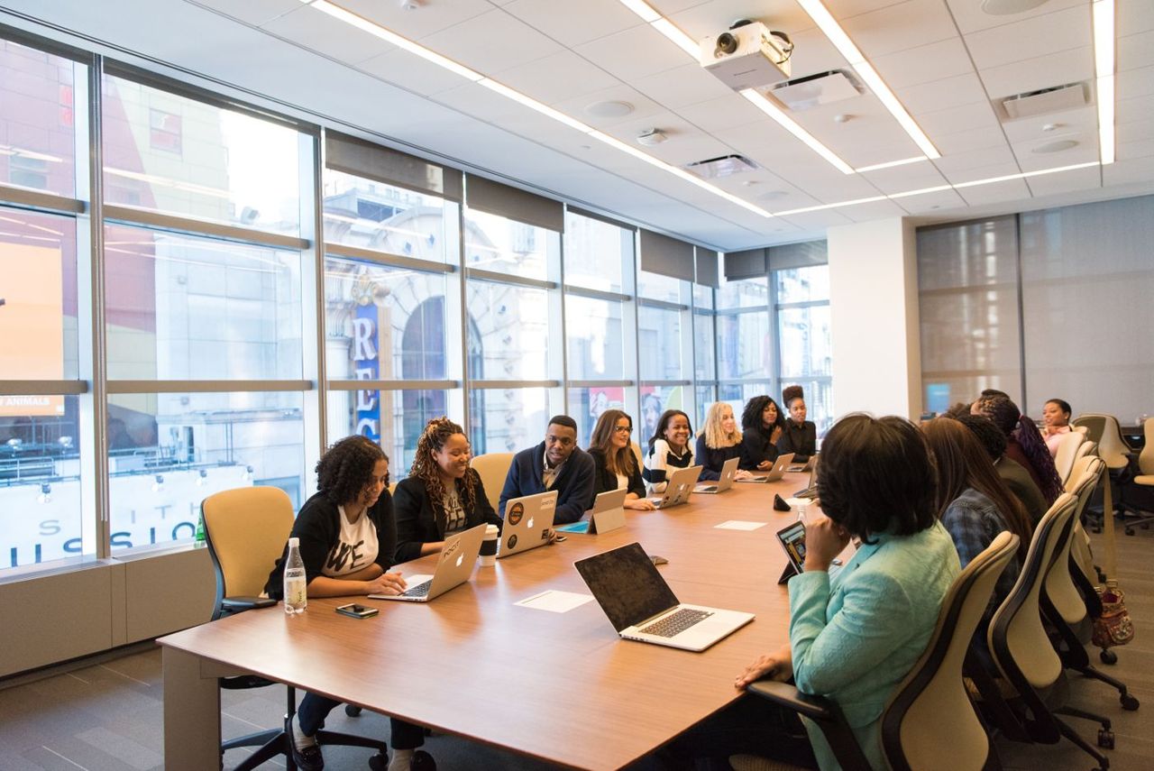 Astute Connect team in a client briefing meeting around a boardroom table