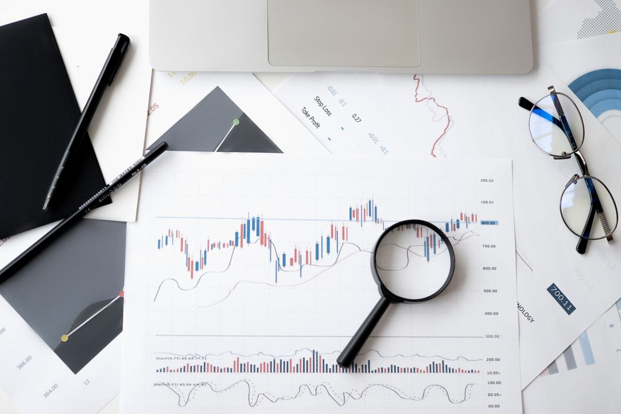 Private equity analyst reviewing market data during deal diligence