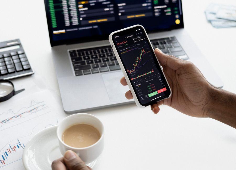 Market data on phone and terminal representing financial services